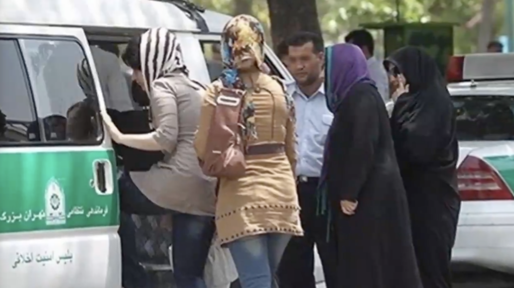 Iranian women being ushered into a van by "Morality police" (Image: X)